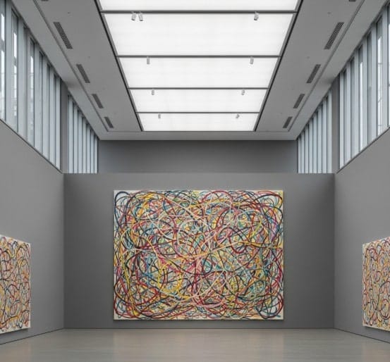 5 Contemporary Artists You Should Know About 2 Wide shot of a gallery space showcasing a large Mehretu canvas filled with lines and color overlays